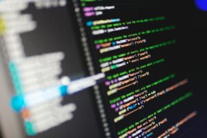 Close-up of a computer screen displaying colorful programming code in JavaScript.