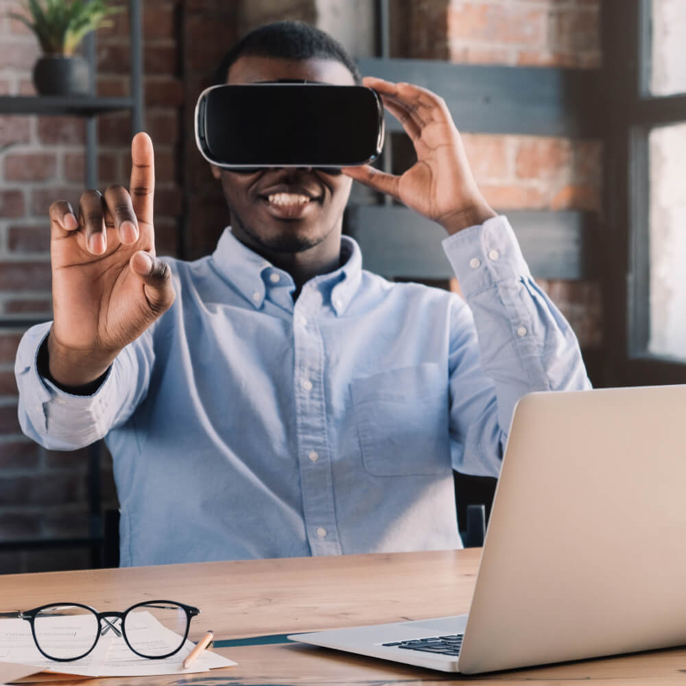 young african businessman in vr headset points fin qsrhluh 1.jpg