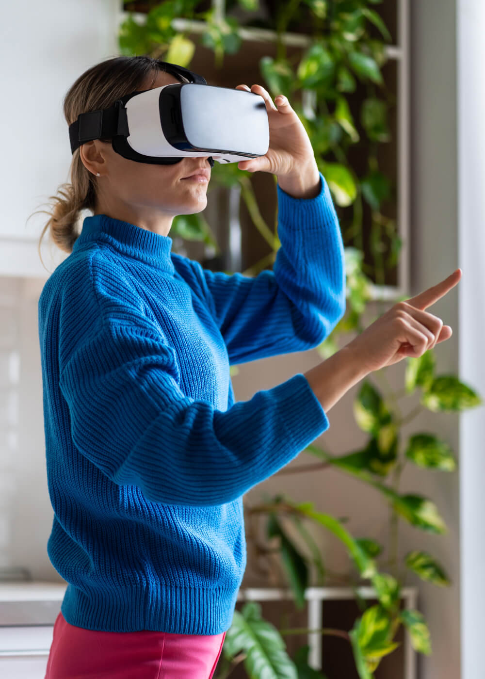 young woman with ponytail in blue sweater enjoys p n93j9j3.jpg